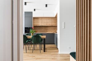 A closeup of a transitional kitchen with wooden cabinets and a white color palette.