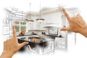 A person's hands form a frame around an illustration of a kitchen remodeling design.