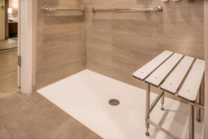 A shower with a wheelchair accessible bench